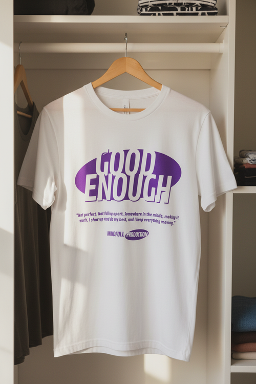 White Good Enough t-shirt hanging in closet
